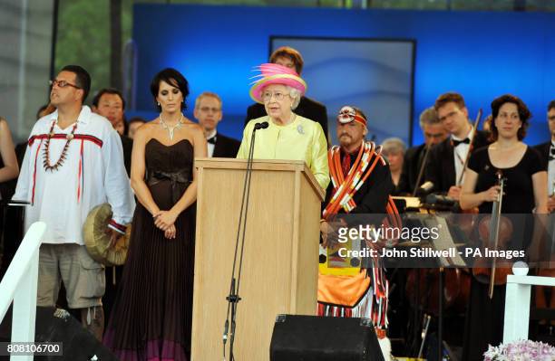 Britain's Queen Elizabeth II, addresses the crowd following a concert at Forks Park, during a visit to Winnipeg, Canada.