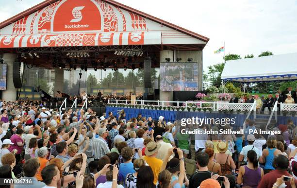 Britain's Queen Elizabeth II and the Duke of Edinburgh sit in the Royal Box , during a concert at Forks Park, as part of their visit to Winnipeg,...