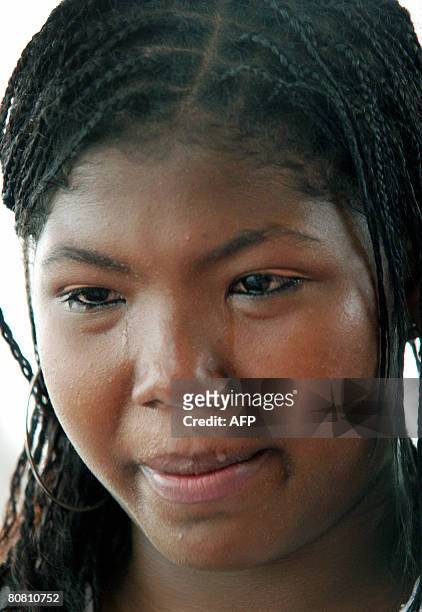 Colombian seventeen-year-old Yanely Galvis, cries after telling her violent life story on April 18, 2008 at Pedro Grau school, where she now sews...