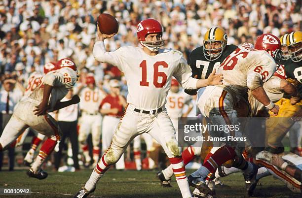 Kansas City Chiefs Hall of Fame quarterback Len Dawson fires a pass duringGreen Bay Packers Hall of Fame fullback Jim Taylor takes the handoff from...