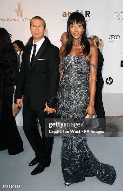 Naomi Campbell and Vladimir Doronin arriving for the amfAR Cinema Against AIDS 2010 fundraiser at the Hotel Du Cap, Eden Roc, Cap D'Antibes during...