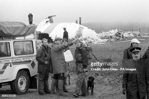 Mountain rescue team helping in the search around Lockerbie, receives instructions near the cockpit of the Pan Am Boeing 103 which was bombed and...