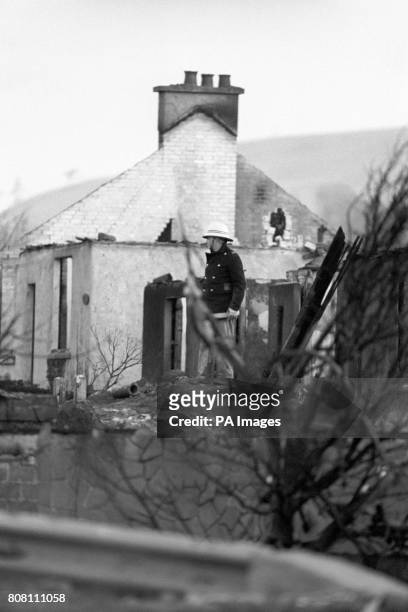 Fireman stands near the 50ft crater which was blasted into a road in Lockerbie, after a Pan Am Boeing 747 was bombed and crashed, killing all 259 on...