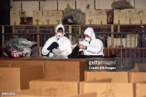 Police officers catalogue the belongings of the passengers and crew of the Pan Am Boeing 747 which was bombed and crashed on to the town of...