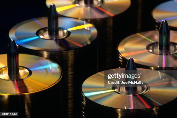 Stacks of compact discs sit on spindles in January of 1990 in a CD replication factory in New York City. Technology has grown exponentially over the...