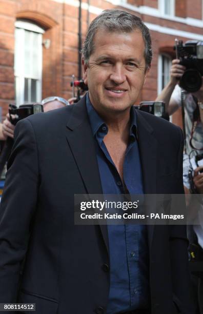 Celebrity photographer Mario Testino arrives at his exhibition of Kate Moss photographs, Kate Who?, in central London.