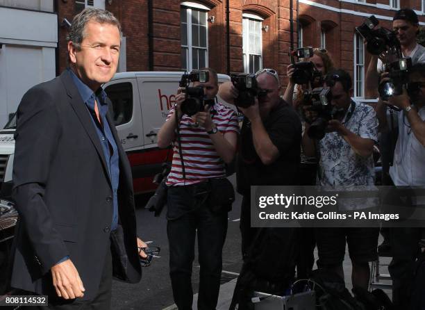 Celebrity photographer Mario Testino arrives at his exhibition of Kate Moss photographs, Kate Who?, in central London.