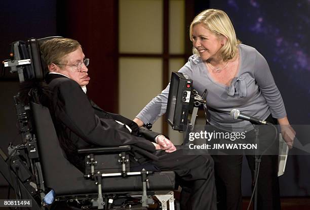 Lucy Hawking touches her father Professor Stephen Hawking as they give a lecture entitled 'Why We Should Go Into Space' during the 50 Years of NASA...