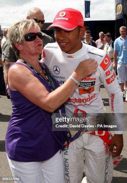 Vodafone McLaren Mercedes' Lewis Hamilton with his mother Carmen Lockhart after he qualified in fourth on Qualifying day ahead of the Santander...