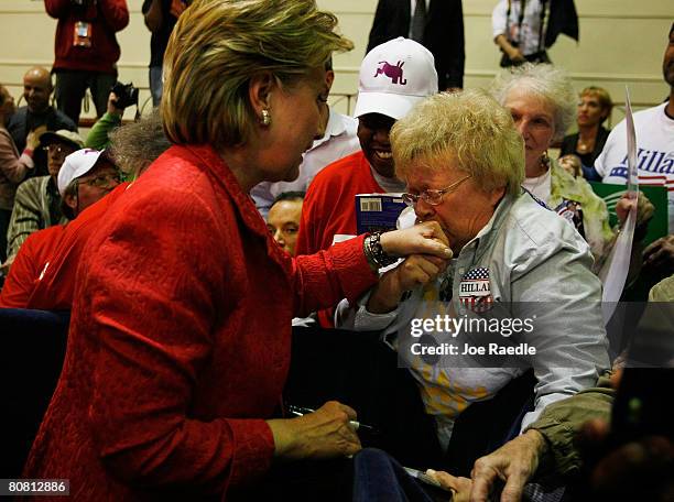 Dee Kaminsky kisses the hand of Democratic presidential hopeful Sen. Hillary Clinton as she greets people during a campaign rally at the Zembo Event...