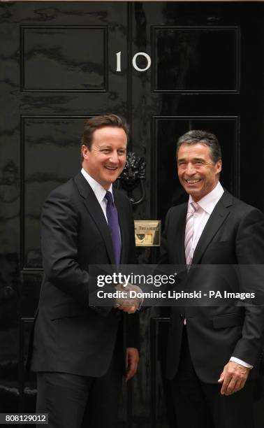 Prime Minster David Cameron greets NATO Secretary General Anders Fogh Rasmussen outside 10 Downing Street, Westminster, London.