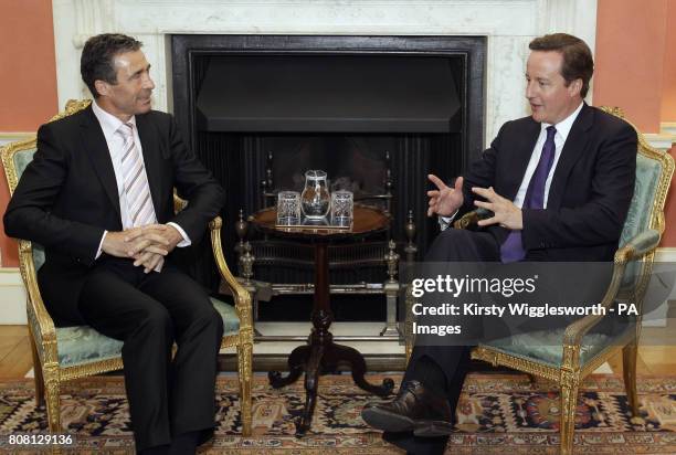 Prime Minster David Cameron speaks with NATO Secretary General Anders Fogh Rasmussen inside 10 Downing Street, Westminster, London.