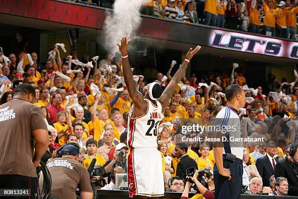 LeBron James of the Cleveland Cavaliers applies chalk to his hands prior to playing against the Washington Wizards in Game Two of the Eastern...