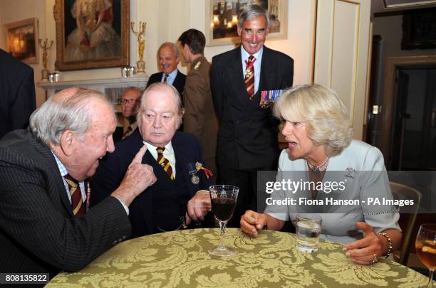 The Duchess of Cornwall speaks with Major Freddie Hunn during a reception for Veterans, serving soldiers and officers of the 9th/12th Lancers at...