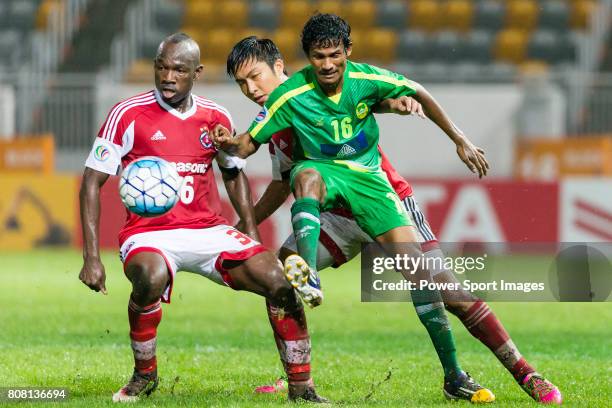 Maziya Sports & Recreation midfielder Hussain Niyaz fights for the ball with South China defender Chak Ting Fung and South China defender Agbo Wisdom...