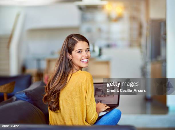 my blog is getting tons of traffic - young woman looking over shoulder stock pictures, royalty-free photos & images