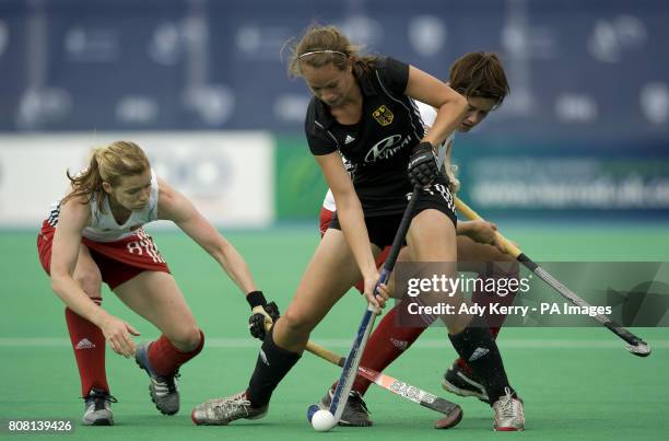 England's Helen Richardson and Sally Walton challenge with Germany's Celine Wilde during the Samsung Women's Champions Trophy Bronze Medal match at...