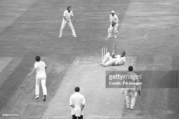 Australian Dirk Wellham ends up on his bottom avoiding a bouncer from England's Ian Botham . At the time Wellham was on 99 during his debut Test and...