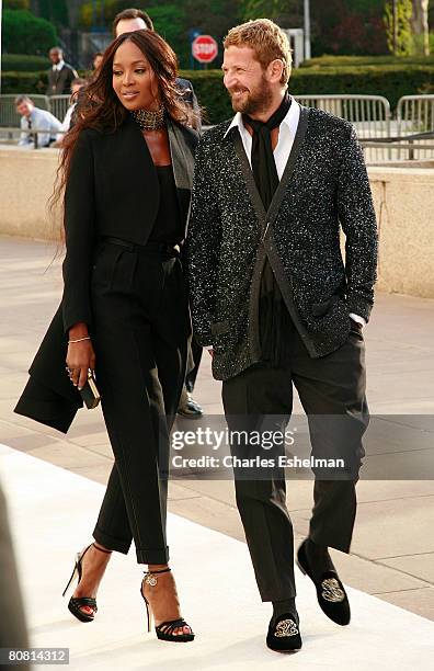 Supermodel Naomi Campbell and Yves Saint Laurent's head designer Stefano Pilati arrive at the Metropolitan Opera "La Fille Du Regiment" opening night...