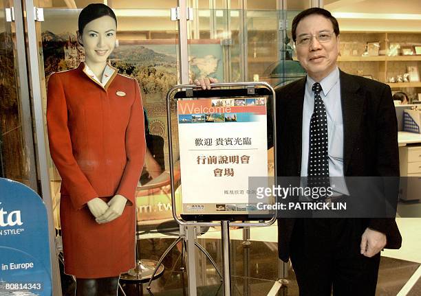 Taiwan-China-politics-economy-tourism by Benjamin Yeh Anthony Liao, president of Taiwan's leading tour agent Phoenix Tours, poses by a cut-out image...
