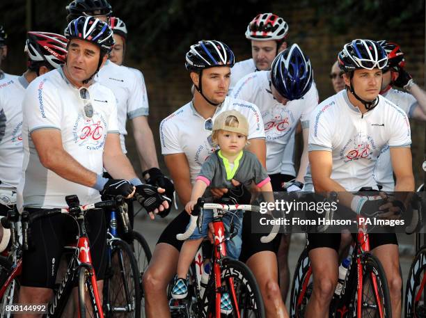 Former British Formula One World champion Nigel Mansell with sons Greg and Leo , before they set off on the Nigel Mansell UK Youth Cycle Challenge,...