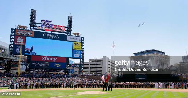 Two A-10 Thunderbolt II "Warthog" military aircraft jets fly over Comerica Park during Independence Day pregame ceremonies before the baseball game...