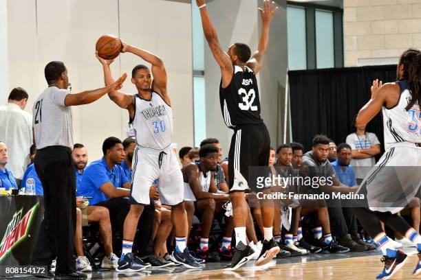 Malcolm Hill of the Oklahoma City Thunder inbounds the ball against the Charlotte Hornets during the 2017 Orlando Summer League on July 4, 2017 at...