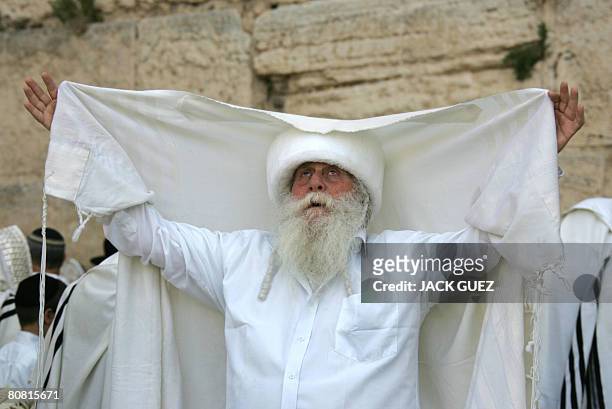 Jewish priests or Cohanim cover their heads and faces with the their Talit or prayer shawl as they take part in a blessing for the Jewish people, at...
