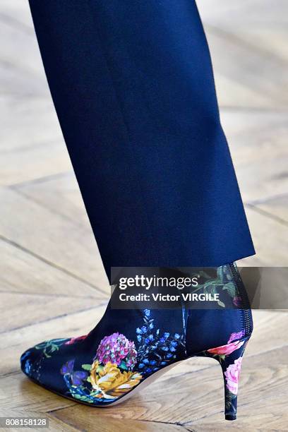 Model walks the runway during the Monique Lhuillier Ready to Wear Spring/Summer 2018 show as part of Haute Couture Paris Fashion Week on July 3, 2017...