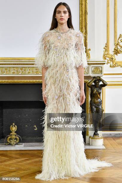 Model walks the runway during the Monique Lhuillier Ready to Wear Spring/Summer 2018 show as part of Haute Couture Paris Fashion Week on July 3, 2017...