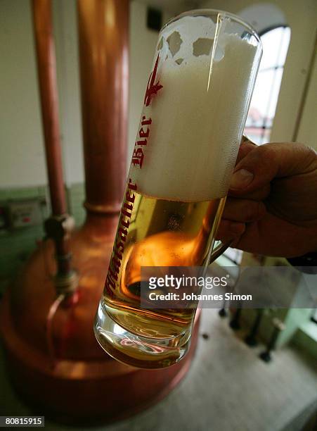 Freshly drawn beer is seen in front of a mash tank at the Maisacher brewery, on April 22, 2008 in Maisach near Munich, Germany. Beer is regarded as...