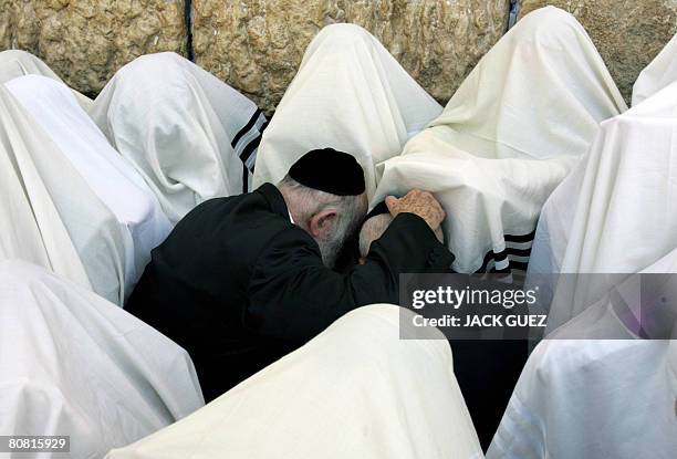 Jewish priests or Cohanim cover their heads and faces with the their Talit or prayer shawl as they take part in a blessing for the Jewish people, at...