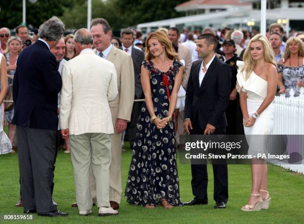 The Prince of Wales chats to Sir Ben Kingsley and Tommy Lee Jones , Cat Deeley and Katherine Jenkins during the Cartier International Polo day, held...