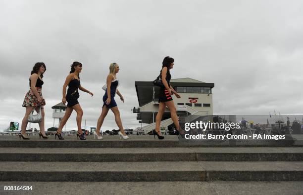 Racegoers Siobhan Mundy, , Lucy Robinson Molly Nightingale , and Helen Fahy on day four of the Summer Festival at Galway Racecourse, Ireland.