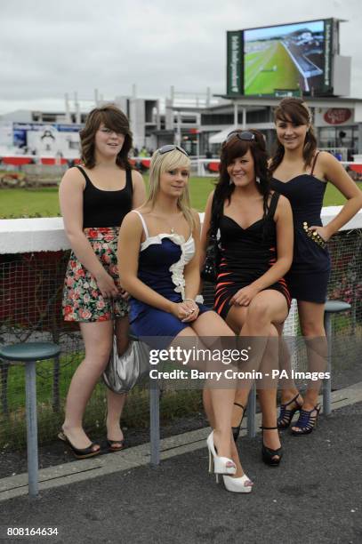 Racegoers Siobhan Mundy, , Molly Nightingale, , Lucy Robinson and Helen Fahy on day four of the Summer Festival at Galway Racecourse, Ireland.
