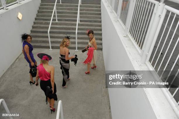 Racegoers Niamh Kealy, , Deirdre Jordan Lisa Buggy and Chrissy Crowley arrive on day four of the Summer Festival at Galway Racecourse, Ireland.