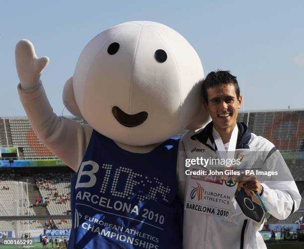 Italy's Daniele Meucci with the Barcelona Games mascot and the Bronze Medal he won in the final of the 10,000m Race during day two of the European...