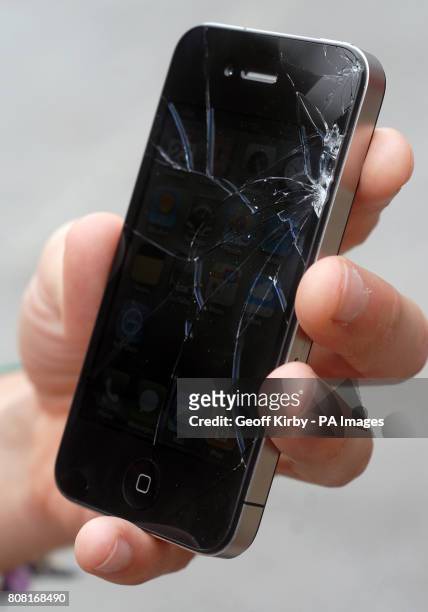 An iphone 4 with a cracked screen