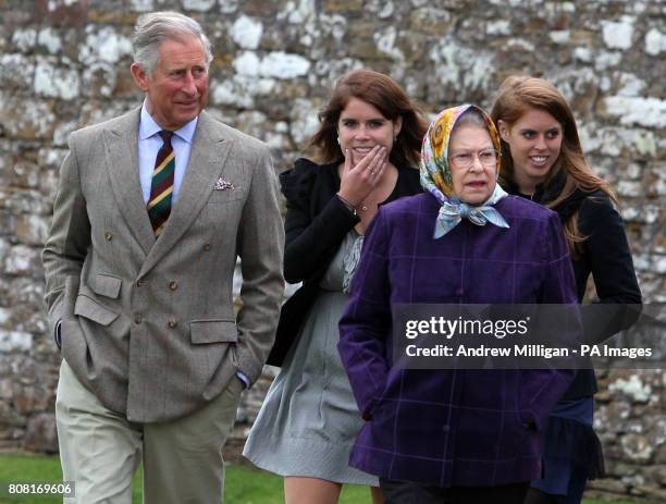 Queen Elizabeth II accompanied by the Prince of Wales , Princess Eugenie, , and Princess Beatrice and the rest of the Royal family at the Castle of...