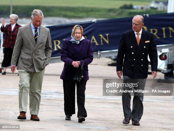 Prince Charles with the Queen and Prince Philip after disembarking the Hebridean Princess boat after a private family holiday with the Queen around...