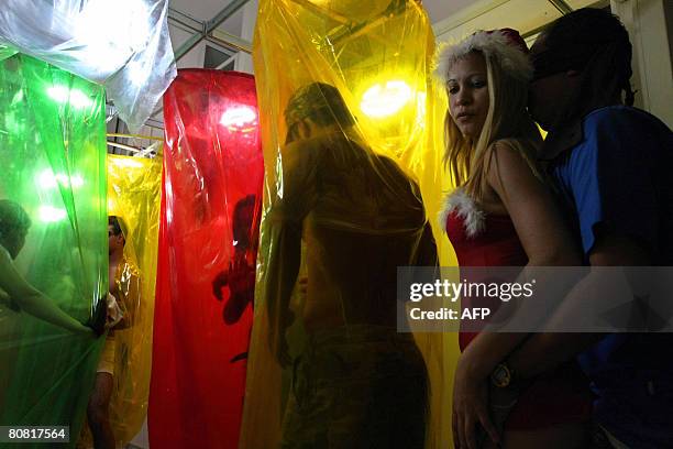 Group of people take part on April 19, 2008 in the 12th Erotika Fair, Latin America's biggest erotica trade show, held at the exhibition hall Mart...