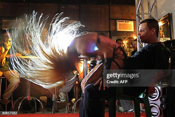 Visitor participates on April 19, 2008 in the 12th Erotika Fair, Latin America's biggest erotica trade show, held at the exhibition hall Mart Centre...