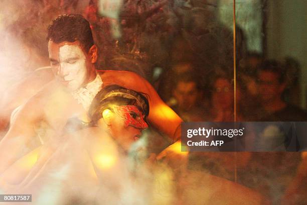 Man and a woman perform a show on April 19, 2008 during the 12th Erotika Fair, Latin America's biggest erotica trade show, held at the exhibition...