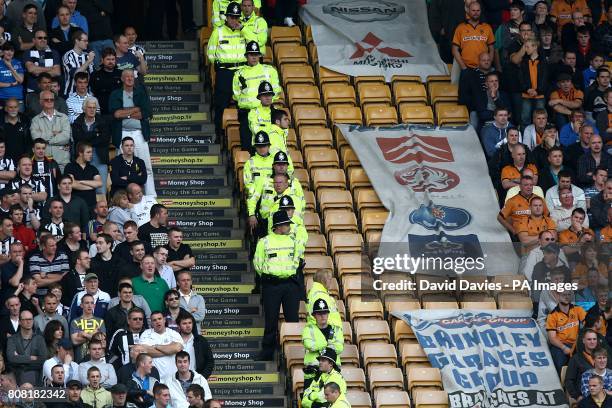 Line of Police separate the two sets of fans in the stands at Molineux