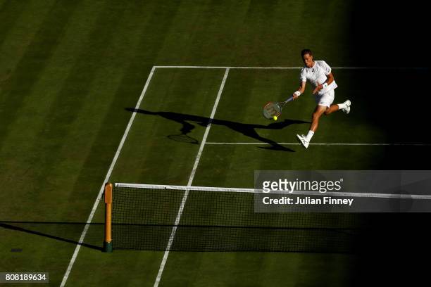 Vasek Pospisil of Canada plays a forehand during the Gentlemen's Singles first round match against Dominic Thiem of Austria on day two of the...