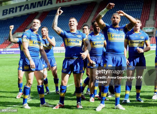 Leeds Rhinos players celebrate their victory during the Carnegie Challenge Cup Semi Final match at the Galpharm Stadium, Huddersfield.