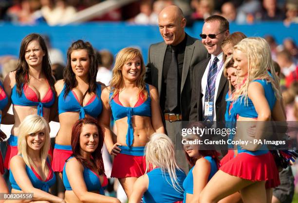 Football referee Howard Webb poses with Wakefield cheerleaders during the engage Super League match at the Belle Vue, Wakefield.