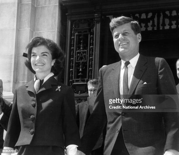 The President and Mrs. Kennedy leave an event April 14, 1961.