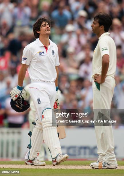 England's Alastair Cook celebrates reaching his century as Pakistan's Mohammad Asif looks on during the third npower Test at The Brit Insurance Oval,...