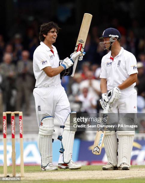 England's Alastair Cook celebrates his century with Jonathan Trott during the third npower Test at The Brit Insurance Oval, London.